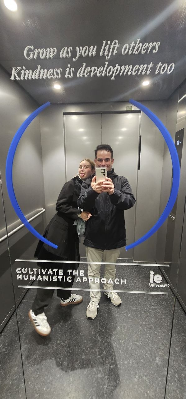 Gabriel and Ximena taking a mirror photo together inside an IE University elevator.