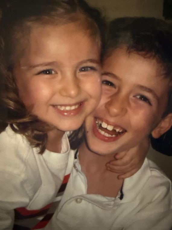 A childhood photo of Ximena and Gabriel Jr. laughing together.
